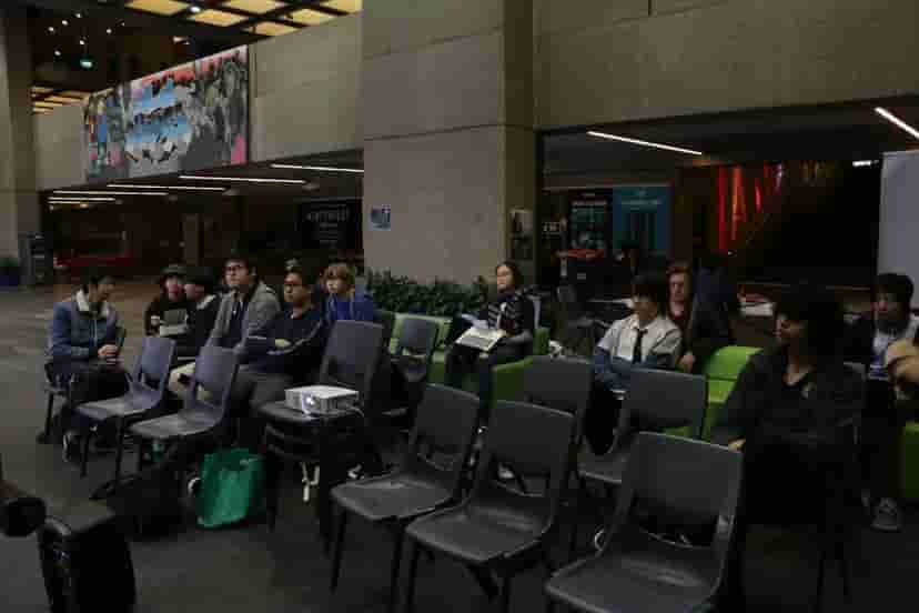 Members watching a movie in building 1